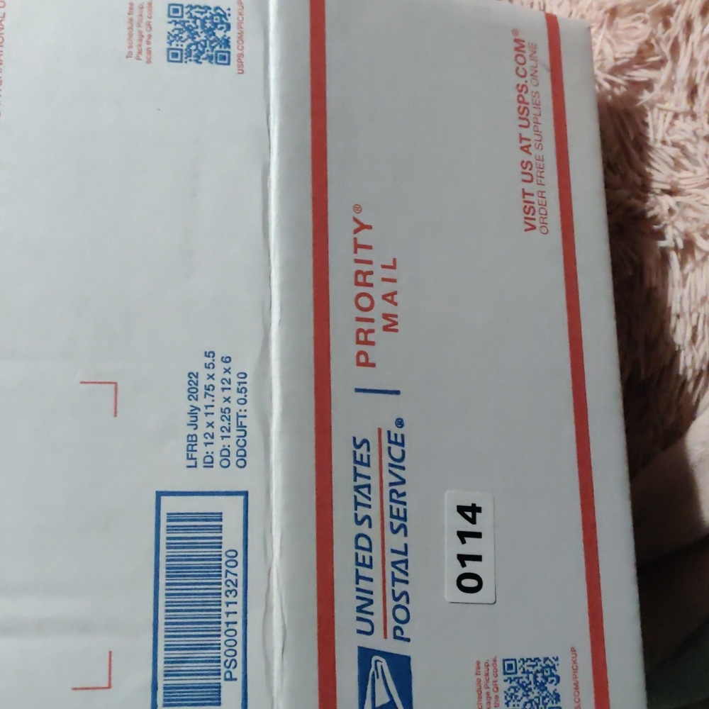 Large USPS priority box full of graphic designed socks